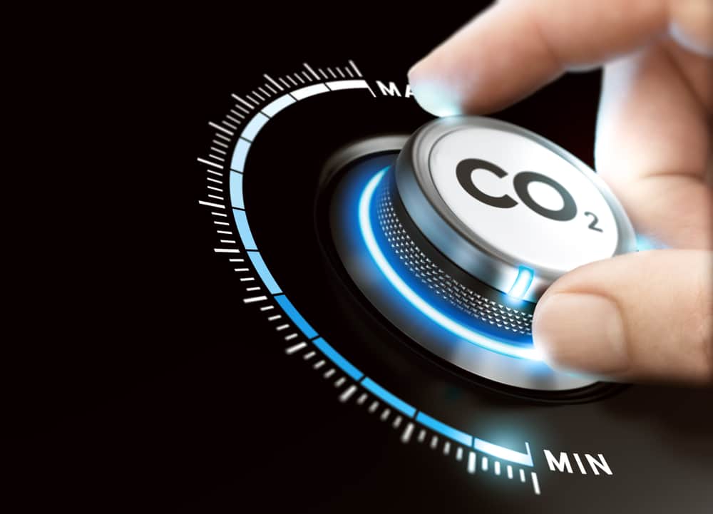 Man turning a carbon dioxide knob